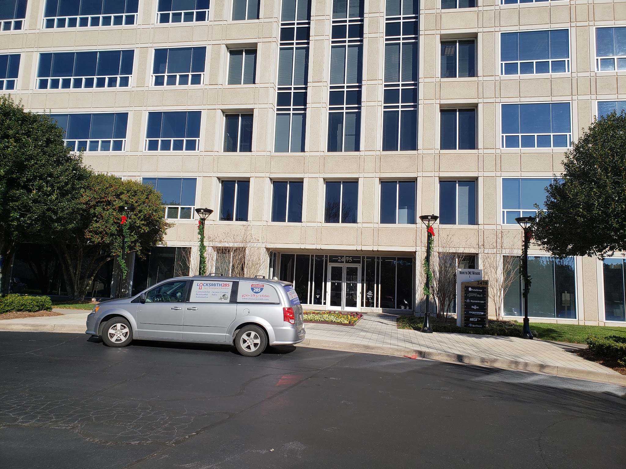 285 Locksmith van parked outside a large office building